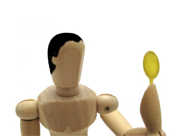 鏡を見る男性の人形