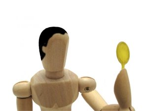 鏡を見る男性の人形
